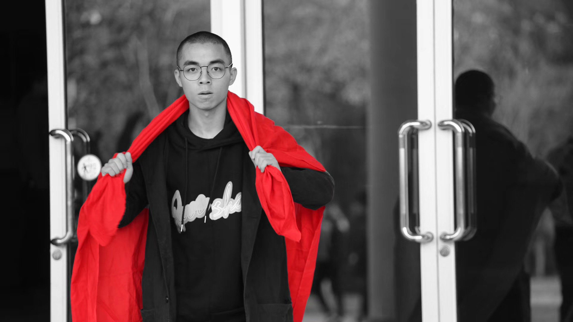 Artist holding red cloth revealing figure in Late performance